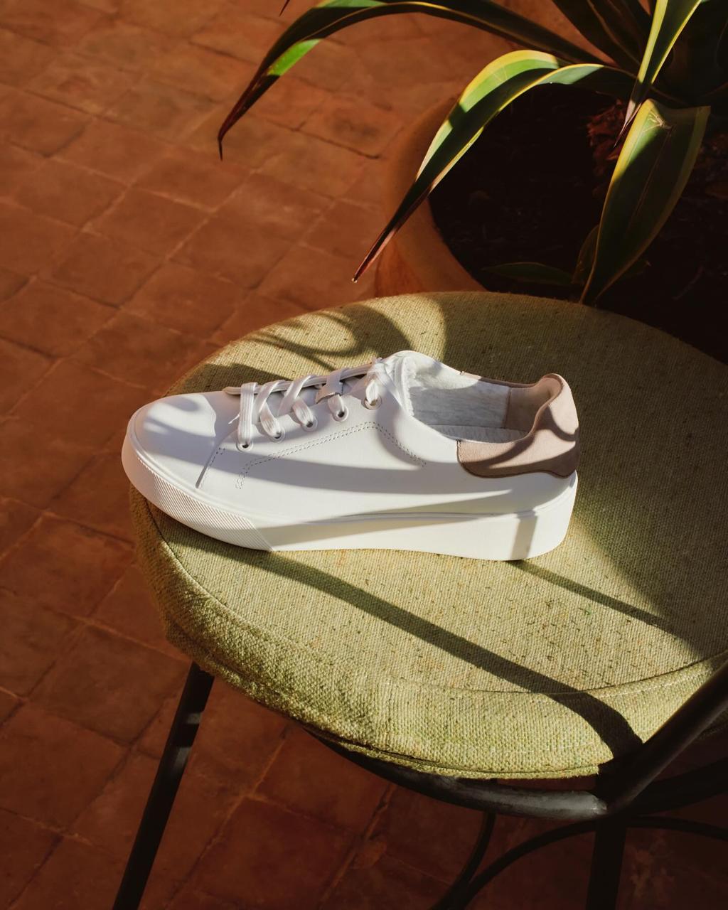White platform sneaker on a terrace stool